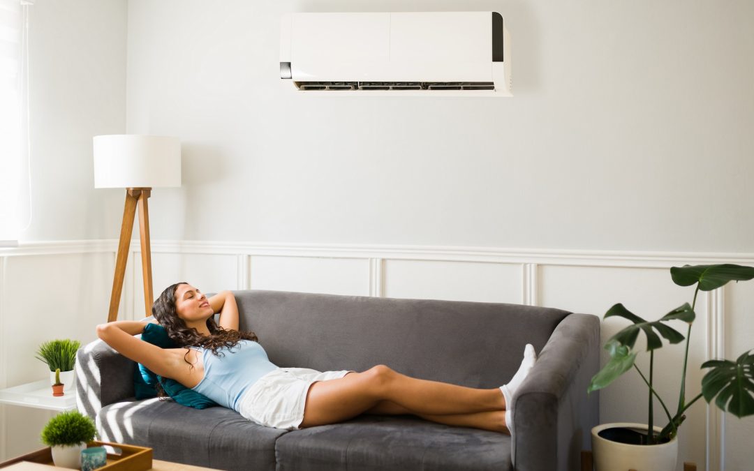 woman enjoying air conditioning at home