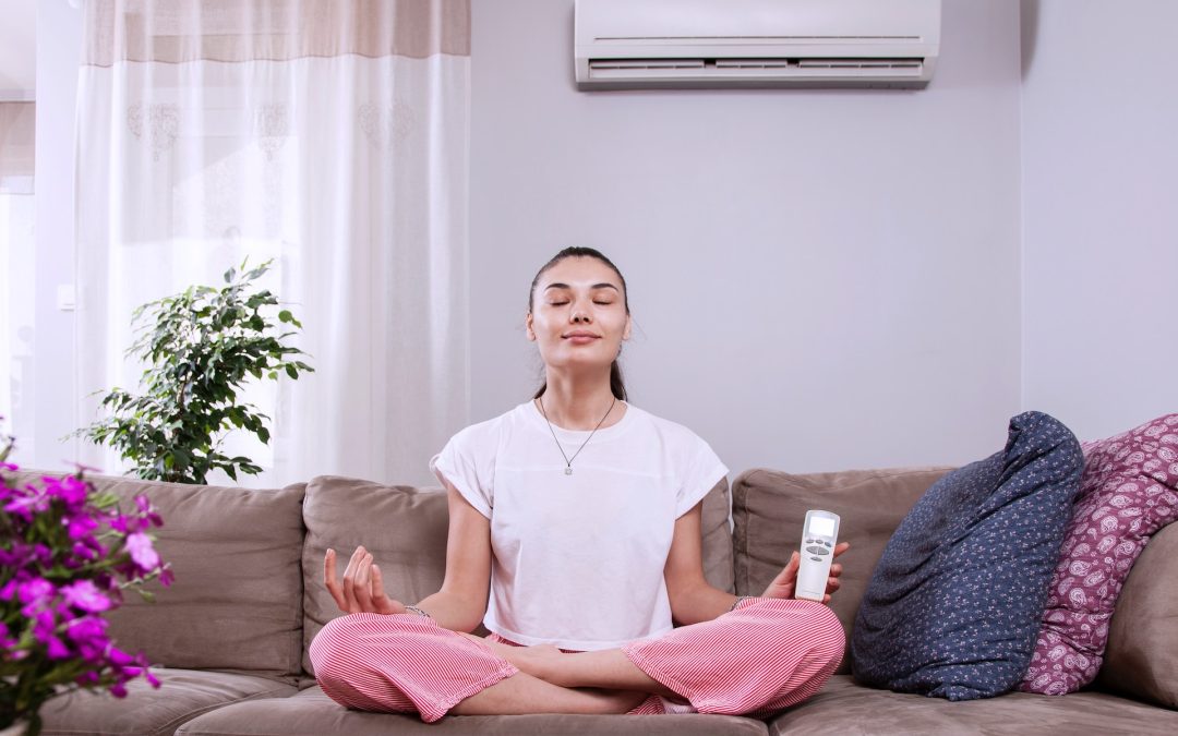 woman at home with air conditioning, HVAC